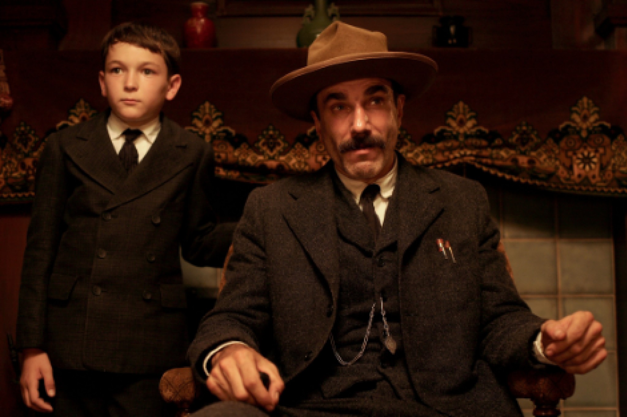 Daniel and His Adopted Son, H.W. Plainview at a meeting