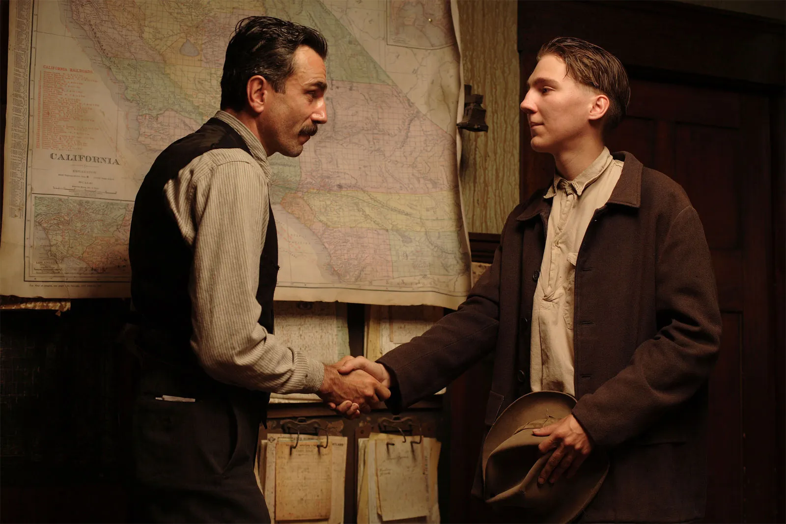 publicity still for the film there will be blood directed by paul thomas anderson featuring actor daniel-day lewis and paul dano